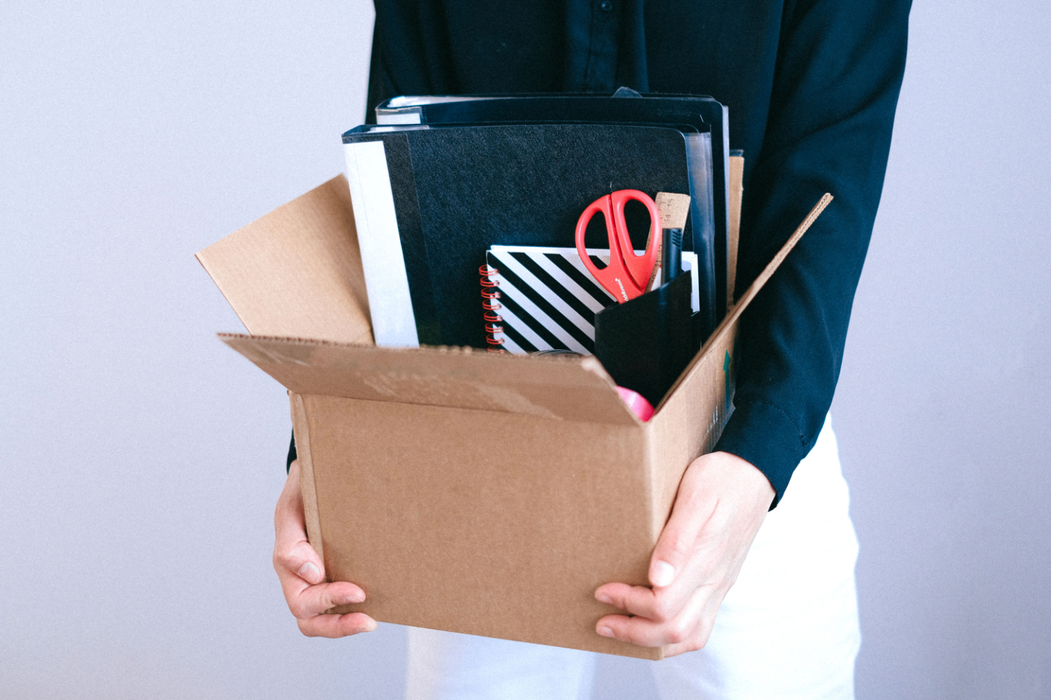 women carry office personal items